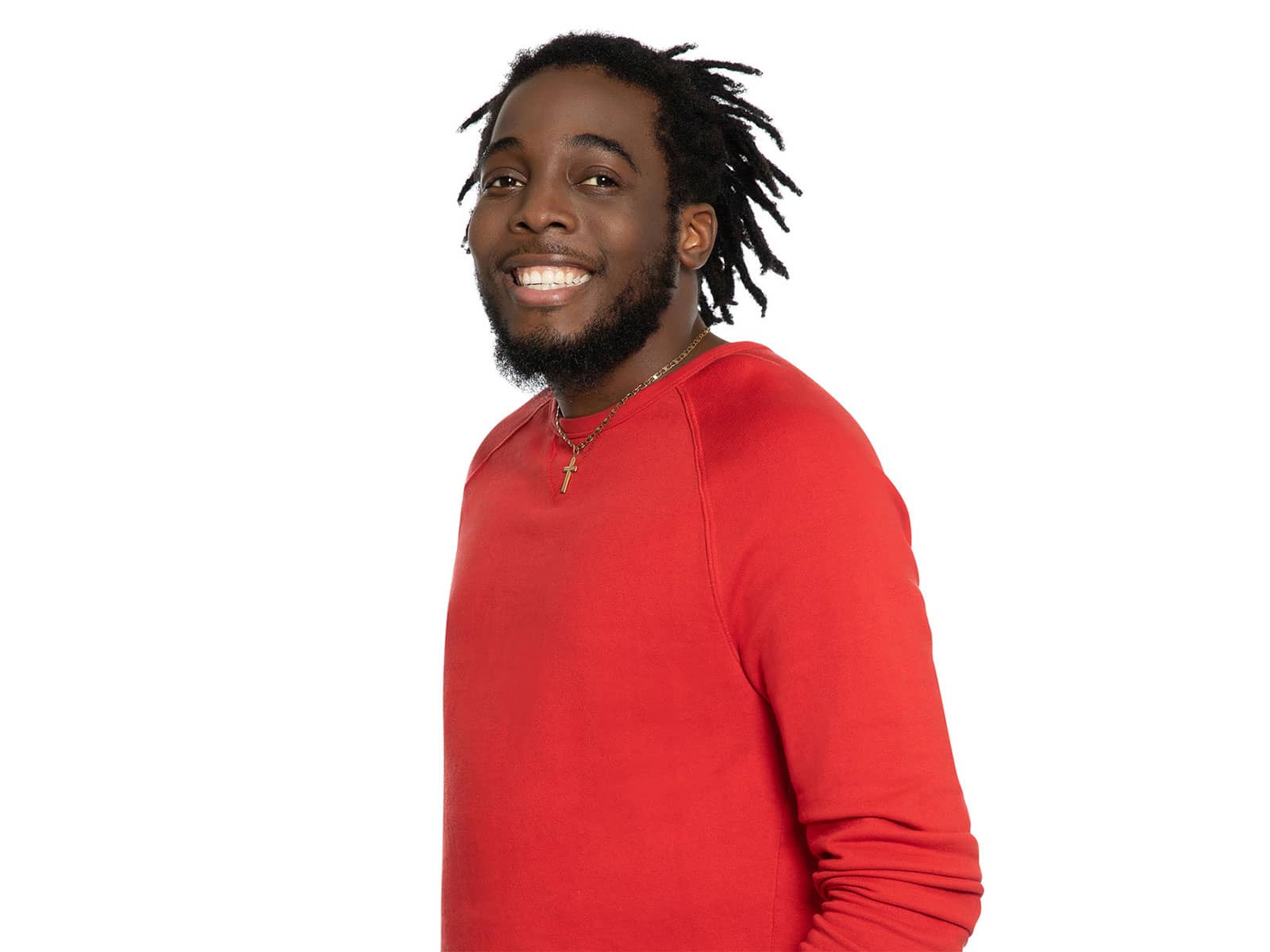 Blood recipient wearing red shirt and cross necklace