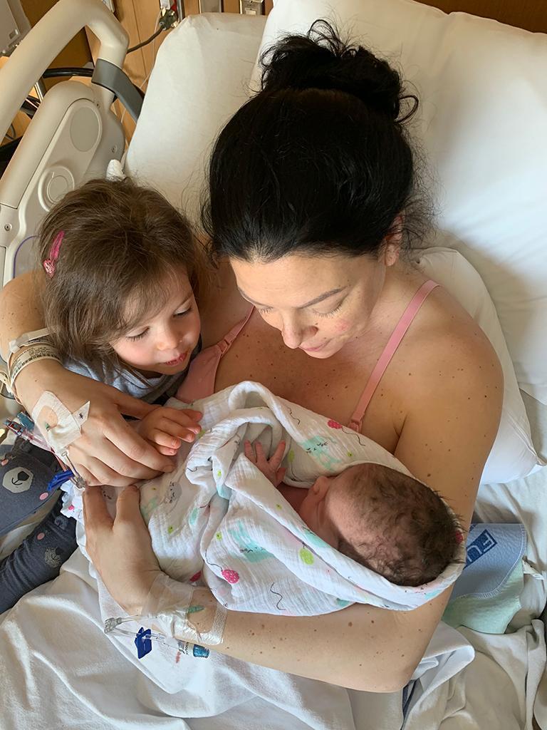 Meghan Trann received blood immediately after the birth of her daughter Ava, seen here with older sister Charlie.