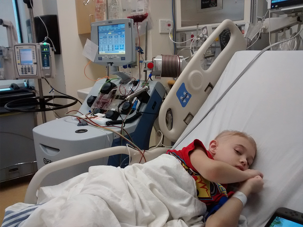 A young cancer patient receiving treatment in hospital