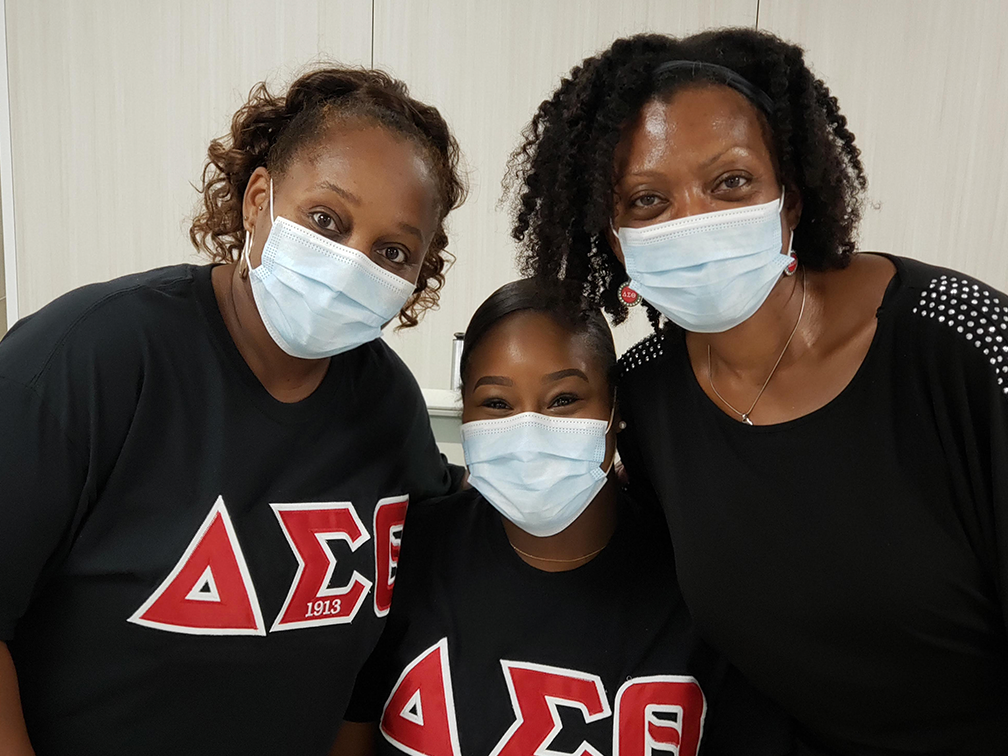 Three members of Delta Sigma Theta Sorority GTA chapter pose after donating blood