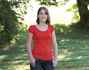 Laura - Stem Cell Recipient Teenage girl standing outside with her thumbs in her pockets