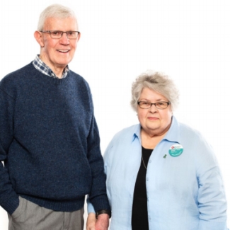 Loreen Hardy-Ramey, a woman in here eighties, stands beside her husband Noel., Hardy-Ramey received the gift of donor endothelial tissue.