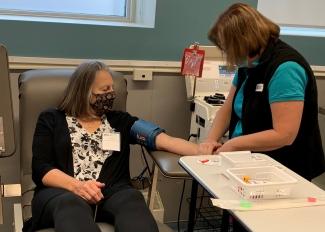 Marlene Wilson donated plasma at the opening of a new plasma donor centre in Sudbury. Her grandson Heydan Morrison relies on medication made from donated plasma.