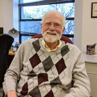 Dr. Michael McDonald sits in his office