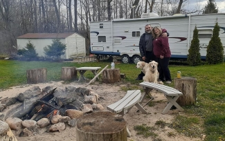 Pedro Custodio camping with his wife and dogs