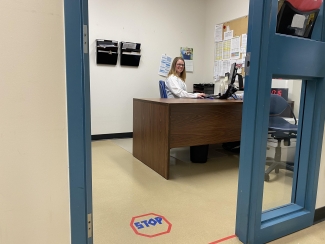 Robyn Johnson at her desk 