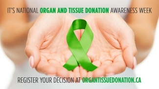 National Organ and Tissue Donation Awareness Week with a pair of hands cupping a green ribbon.
