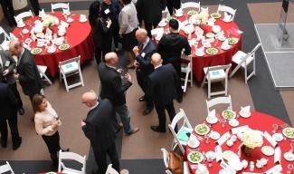 Group of people mingling at the 8th Annual Corporate Supporters’ Luncheon