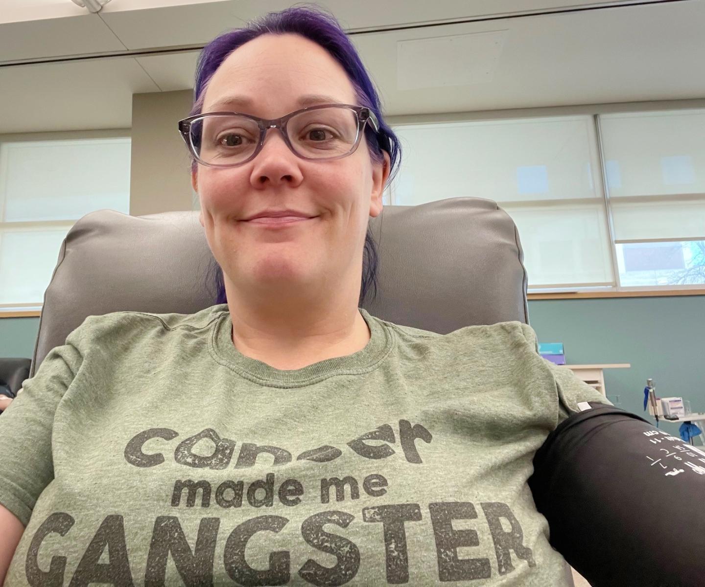 Blood donor with T-shirt that says "Cancer made me gangster"
