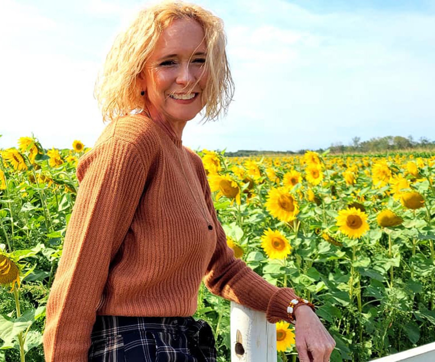 Woman in sunflower field