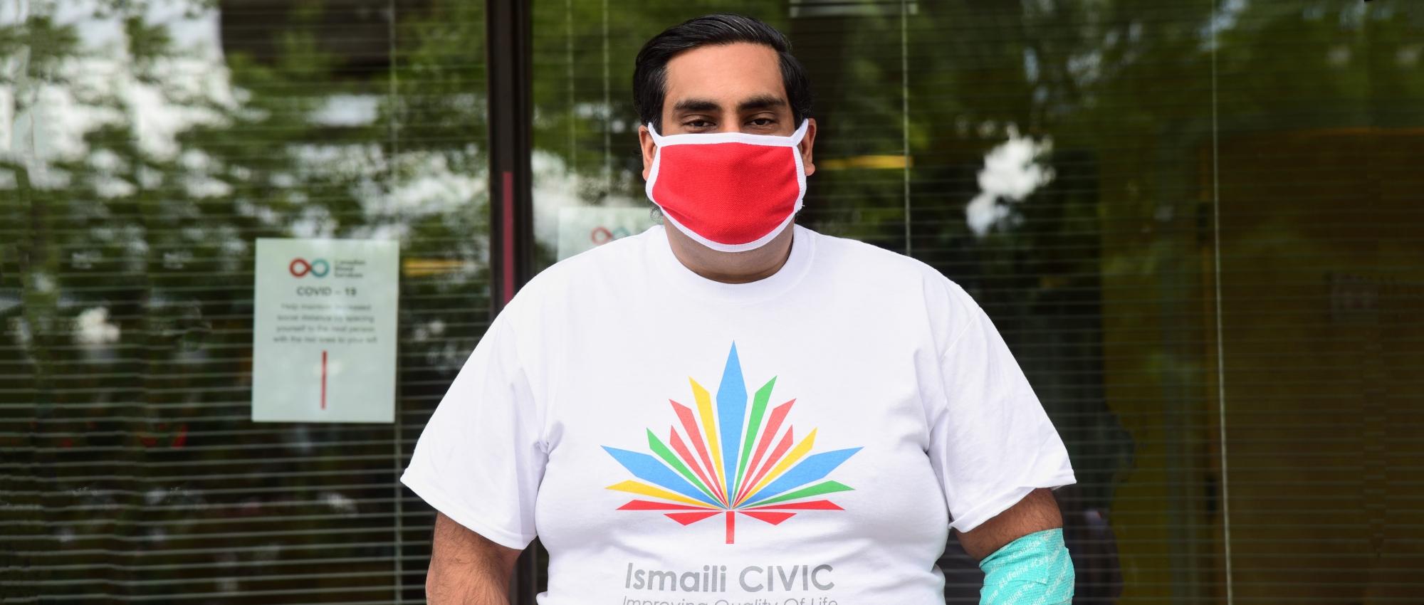 a man wearing an ismali civic t shirt