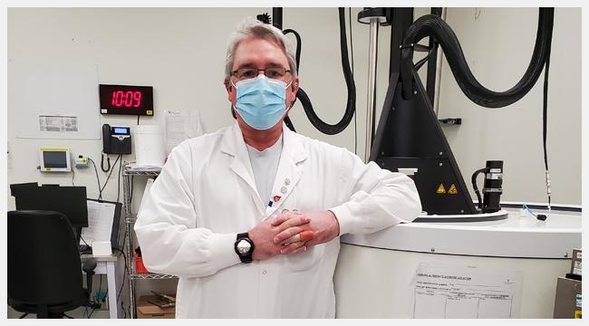 James McCarroll, a medical laboratory technologist, leans on a piece of equipment at a Canadian Blood Services facility that processes stem cells for autologous stem cell transplants. 